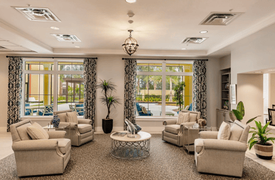 Bright common area with seating and outdoor view