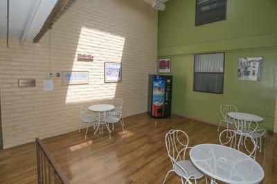 Bright common area with tables and chairs