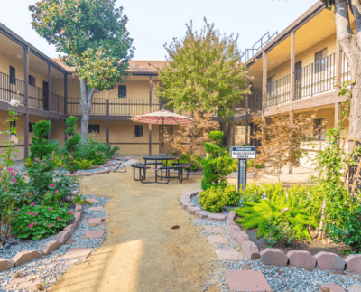 Beautiful courtyard garden with seating area and landscaping