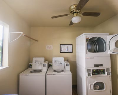 Laundry room with washing machines and dryers