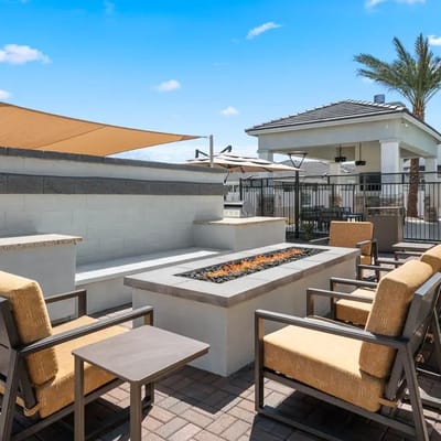 Outdoor seating area with fire pit and lounge chairs