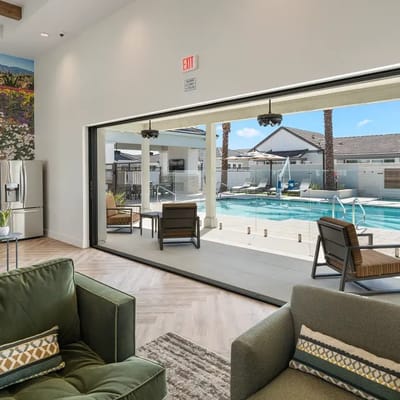 Bright common area with a view of the pool