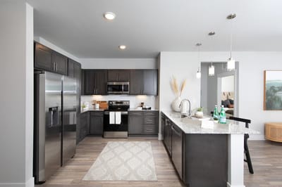 Modern kitchen interior with granite countertops and appliances