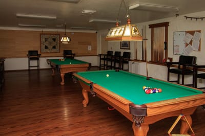 Interior of the recreation room with pool tables