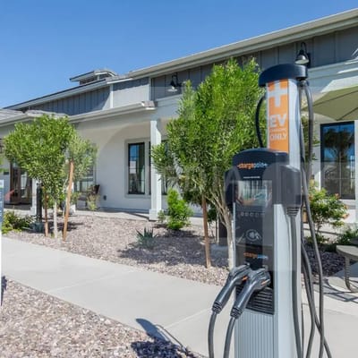 Outdoor electric vehicle charging station by the facility