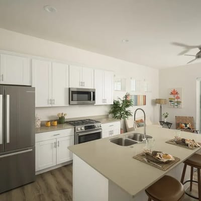 Modern kitchen interior with white cabinets and appliances