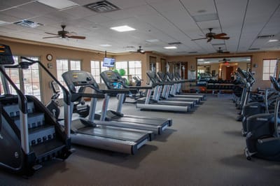Interior view of a fitness center with exercise equipment