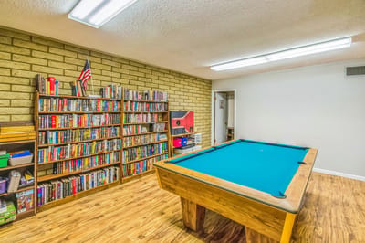 Inside view of a common area with a pool table