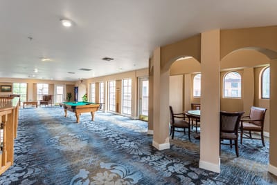 Interior common area with seating and a pool table