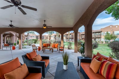 Outdoor seating area with vibrant cushions and plants