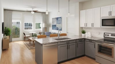 Modern kitchen and living area in a senior living unit
