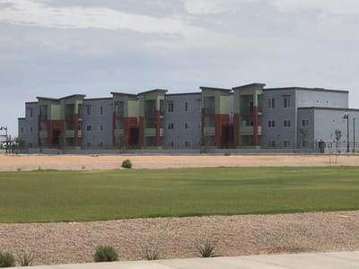 Exterior view of the Oasis at The Wells Apartments