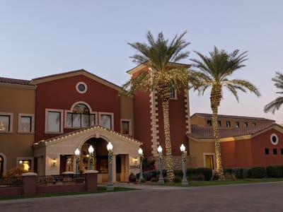 Exterior view of a senior living facility at dusk