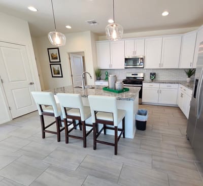 Modern kitchen with white cabinets and granite countertops