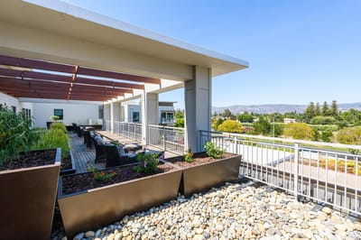Outdoor terrace with seating and garden planters