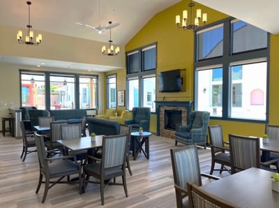 Bright common area with comfortable seating and large windows