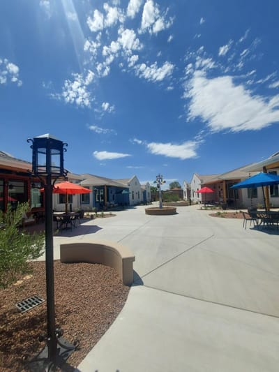 Outdoor courtyard with colorful umbrellas and seating