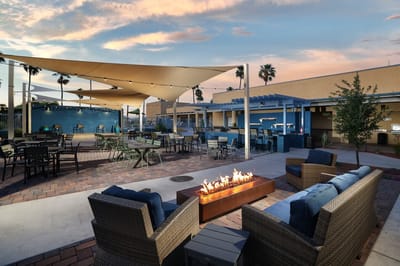 Outdoor seating area with fire pit and shelter