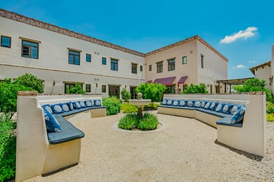 Outdoor courtyard with seating and greenery