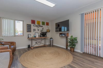 Cozy common area with a coffee station and seating