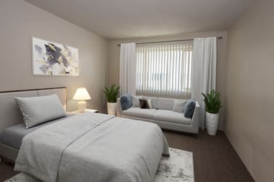 A well-furnished resident room with modern decor