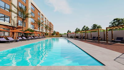 Outdoor pool area with lounge chairs and landscaping
