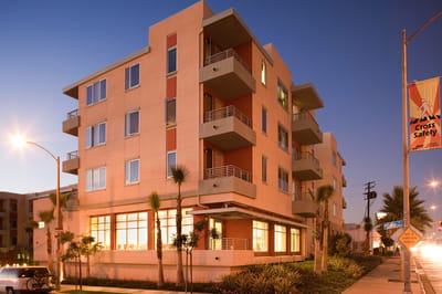 Exterior view of Long Beach Senior Housing at dusk