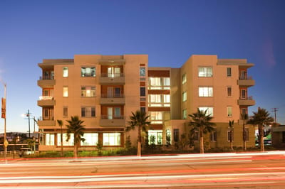 Exterior view of Long Beach Senior Housing at dusk