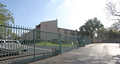 Exterior view of the facility with gated entrance