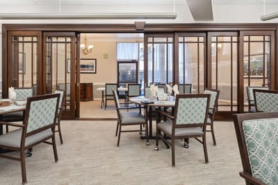 Bright dining area with tables and chairs