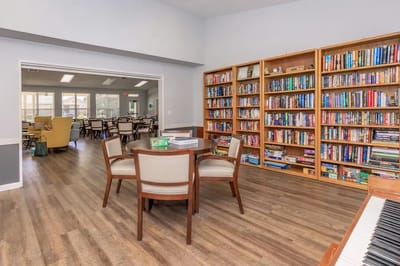 Interior view of a common area with bookshelves and seating