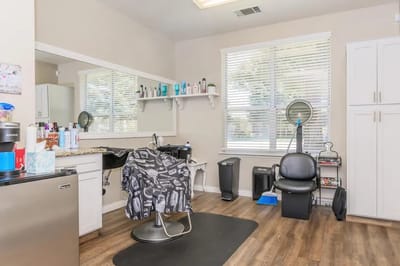 Hair salon setup with chair and styling products