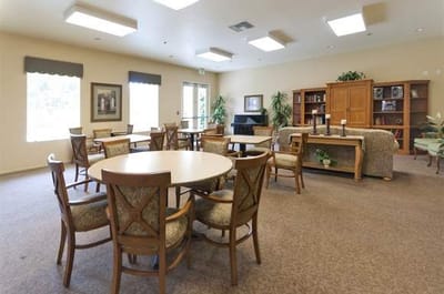 Bright interior common area with seating and bookshelves