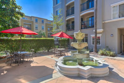 Outdoor space with fountain and seating