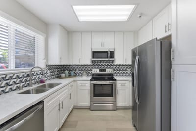 Bright kitchen with modern appliances and decor