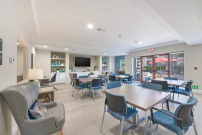 Bright common area with tables and seating