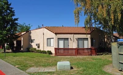Exterior view of building with landscaped area
