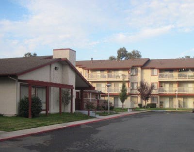 Exterior view of Hammer Lane Village facility with landscaping