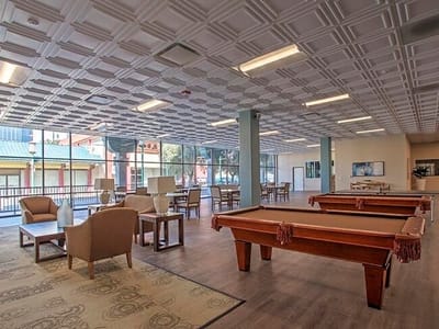 Bright and spacious common area with pool tables