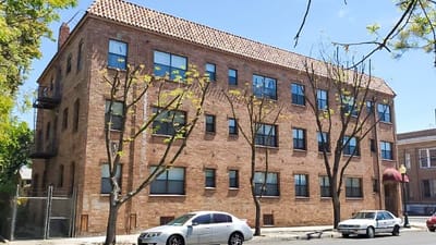 Exterior view of Delta Plaza Apartments building