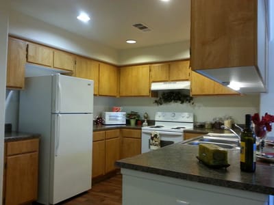 Bright kitchen with wooden cabinets and appliances