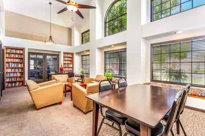 Bright common area with seating and bookshelves