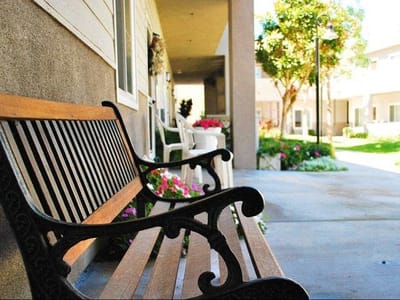 A bench in a garden area of the facility