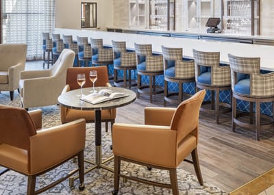 Elegant seating area in a common space with a bar