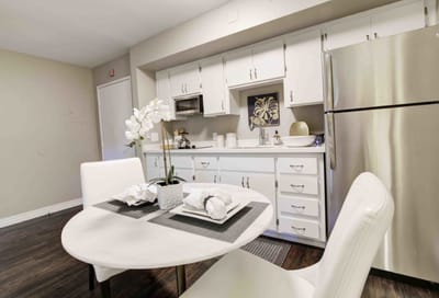 Bright interior view of a kitchenette with dining area