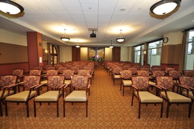 Interior meeting room with rows of empty chairs