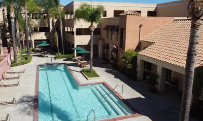 Aerial view of a swimming pool and courtyard area