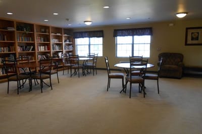 Interior view of a cozy common area with bookshelves