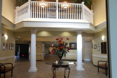 Interior view of the facility lobby with floral arrangement