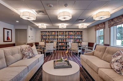Bright common area with bookshelves and seating